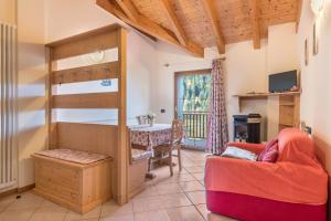 a living room with a loft bed and a table at Dimora La Quiete in Bedollo
