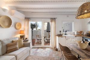 a living room with a couch and a table at Casa de Benafim 51 in Benafim