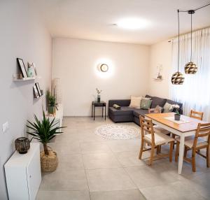 a living room with a table and a couch at Apartment Manuela in Merano