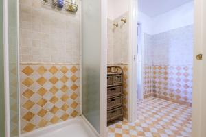a bathroom with a shower with a tub at Casa della Poiana in Lipari +22 photos