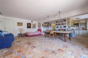a living room with a table and a couch at Casa della Poiana in Lipari