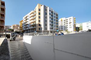 a view of a city with tall buildings at Quarteira Beach I in Quarteira
