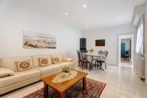 a living room with a couch and a table at Casa Lago Leo in Omegna