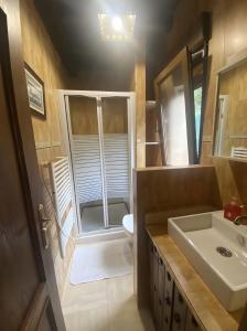a small bathroom with a sink and a toilet at Los Avellanos Casa 3 in Celis +16 photos