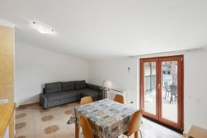 a living room with a couch and a table at Ce Tour - Casa Cetara Centro 1 in Cetara