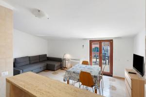 a living room with a table and a couch at Ce Tour - Casa Cetara Centro 1 in Cetara