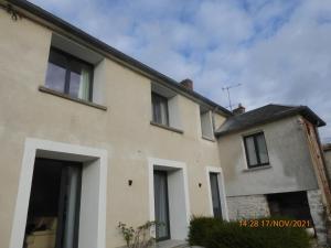 a large building with windows on the side of it at La faustinière in Andonville +4 photos