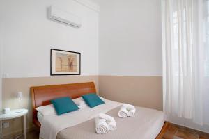 a bedroom with two beds with towels on them at Holiday sea 1 in Diano Marina