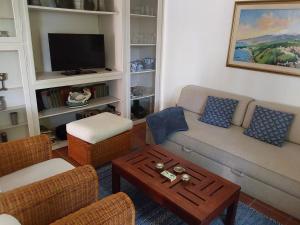 a living room with a couch and a coffee table at Ferienwohnung Cipolla in Oberkirch