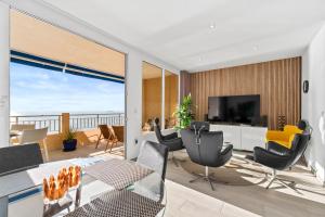 a living room with a view of the ocean at 100 Beach Seaview in Torrevieja
