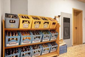 a display of bottles of beer in boxes at Kraichgauer Haus in Oberreute