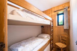 a bedroom with bunk beds in a tiny house at Studio 4 - La Bruyère in Crest-Voland