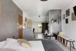 a bedroom with a bed and a living room at Chambre D'hôtes Take-off - Chambre in Saint-Georges-sur-Cher +15 photos