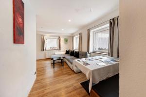 a living room with a couch and a table at Apartment Bergkristall in Nova Levante
