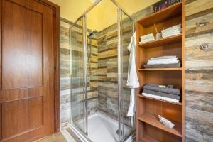 a shower with a glass door in a bathroom at Casa Dea72 in Santa Luria +30 photos