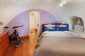 a bedroom with a bed and a bike in it at Casa Al Molo in Musso