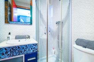a bathroom with a shower and a sink at Neptuno in Oropesa del Mar +19 photos