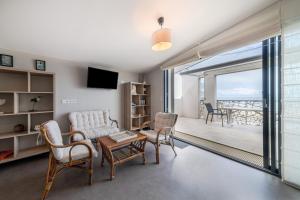 a living room with a view of the ocean at Le Rêve 210 in La Tranche-sur-Mer