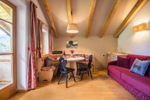 a living room with a couch and a table at Oberplunerhof - Fewo Gitschberg in Chienes