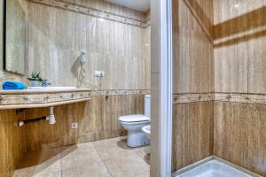 a bathroom with a toilet and a sink and a shower at Apartament Yaco 2 in Lloret de Mar +13 photos