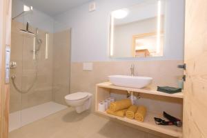 a bathroom with a sink toilet and a shower at Ferienwohnung Wold Wieserhof in Aldino