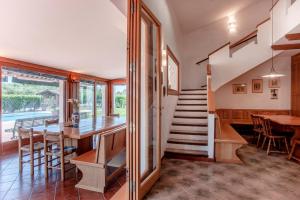 a kitchen and dining room with a staircase and a table at Villa Sole Pula in Pula