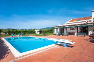 a swimming pool in front of a house at Villa Sole Pula in Pula