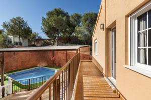 a balcony with a swimming pool on a house at Mi Bella in Totana