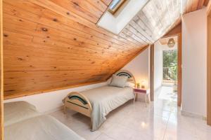 a bedroom with a bed and a wooden ceiling at Mi Bella in Totana +23 photos