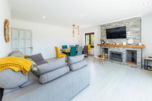 a living room with a couch and a fireplace at Sestel in Capdepera