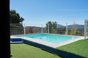 a swimming pool with a fence around it at La Sierrezuela in Castillo de Locubín