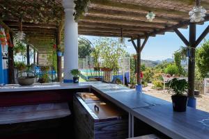an outdoor kitchen with a counter and a view at La Sierrezuela in Castillo de Locubín