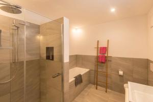 a bathroom with a shower and a sink at Appartement Rosa Seis in Kastelruth +21 photos