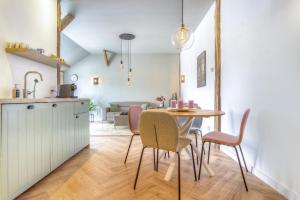 a kitchen and dining room with a table and chairs at Ferrienhaus Land Hof Spelle in Spelle