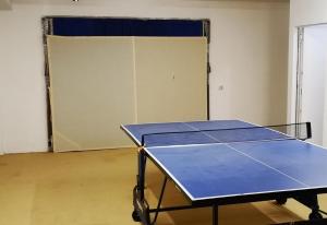 a ping pong table in a room with a door at Casa Danca Cabopino in Marbella