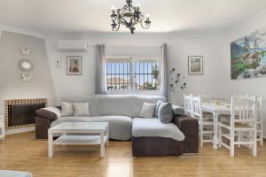 a living room with a couch and a table at Casa Alfonso Manuel in Roche