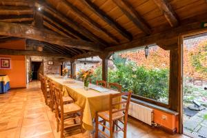 a long dining room with a long table and chairs at La Casona De Barrio in Barrio