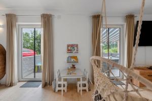 a room with a hammock and a table and a window at Bella Casa in Sankt Wendel