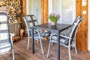 a black table and chairs on a porch at Apartment Casa Gina in Stockach
