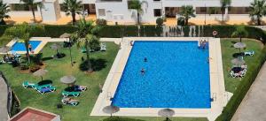 an overhead view of a swimming pool in a resort at La Cala Apartment in La Cala de Mijas