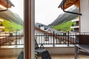 a balcony with a view of a mountain at Alpenflora 2 in Ischgl
