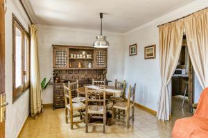 a dining room with a table and chairs at Casa Saguer in L'Escala