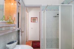 a bathroom with a shower and a white sink at Casina di Marnie in Balestrate +16 photos
