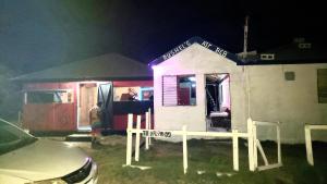 a small house is lit up at night at rushels in Drunkenmans Cay