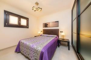 a bedroom with a bed and two night stands at Neo in Cala Ratjada