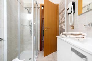 a bathroom with a shower and a sink at Rustico Spagnol 4 in Tignale +31 photos