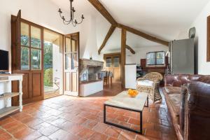 a living room with a couch and a table at Casa di Pruno in Figari
