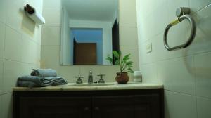 a bathroom with a sink and a mirror at El Aromito in Jesús María +4 photos