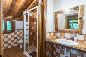 a bathroom with a sink and a toilet at La Hirriria in San Roque de Ríomiera +22 photos