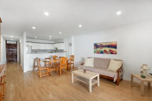 a living room with a couch and a table at Apto Tomasol in Los Cristianos